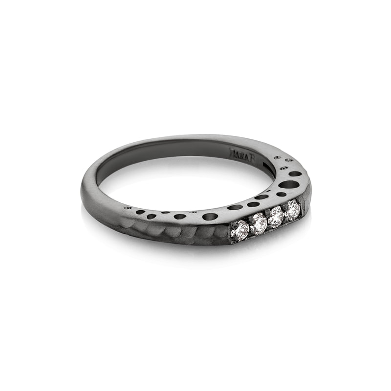 Blackened Sterling Silver ring with 4 diamonds on the squared top and open circles on the gallery sides.