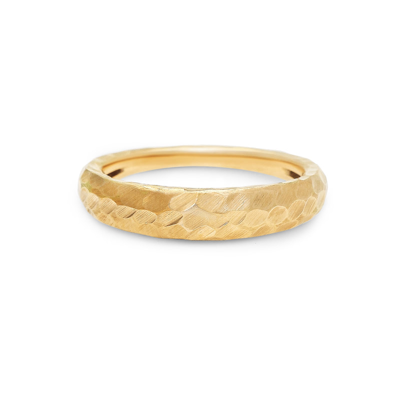 18 Karat Yellow Gold ring with a hammered band.