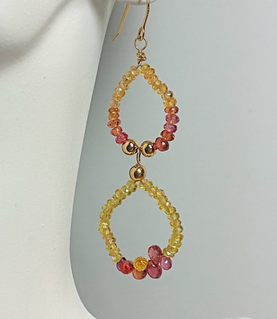 14 Karat Yellow Gold French Wire earrings with double drop beaded multi-color Sapphires.