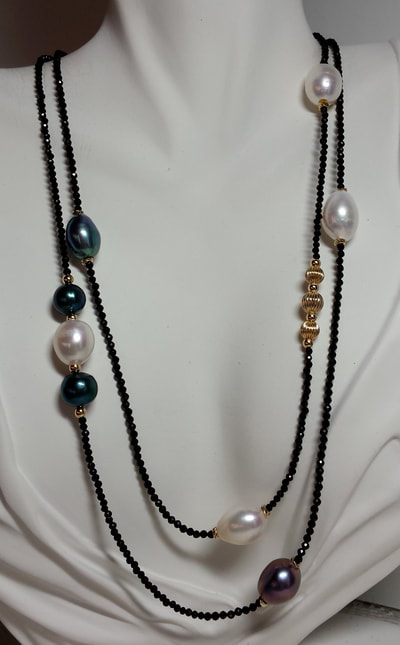 14 Karat Yellow Gold 40" necklace with black and white pearls and small Black Spinel.