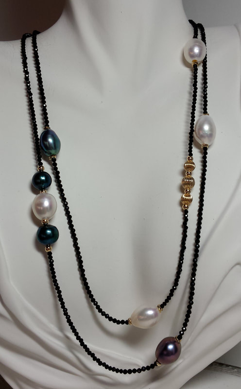 14 Karat Yellow Gold 40" necklace with black and white pearls and small Black Spinel.