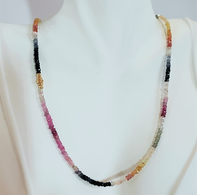 14 Karat Yellow Gold multi-color Sapphire beaded necklace.