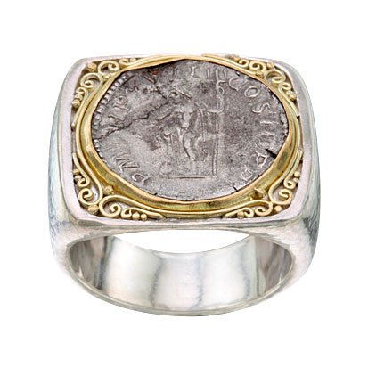 Silver wide band ring with a Roman coin in the center and 18 Karat Yellow Gold scroll work surrounding it.