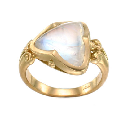 18 Karat Yellow Gold ring with a triangular moonstone in the center.
