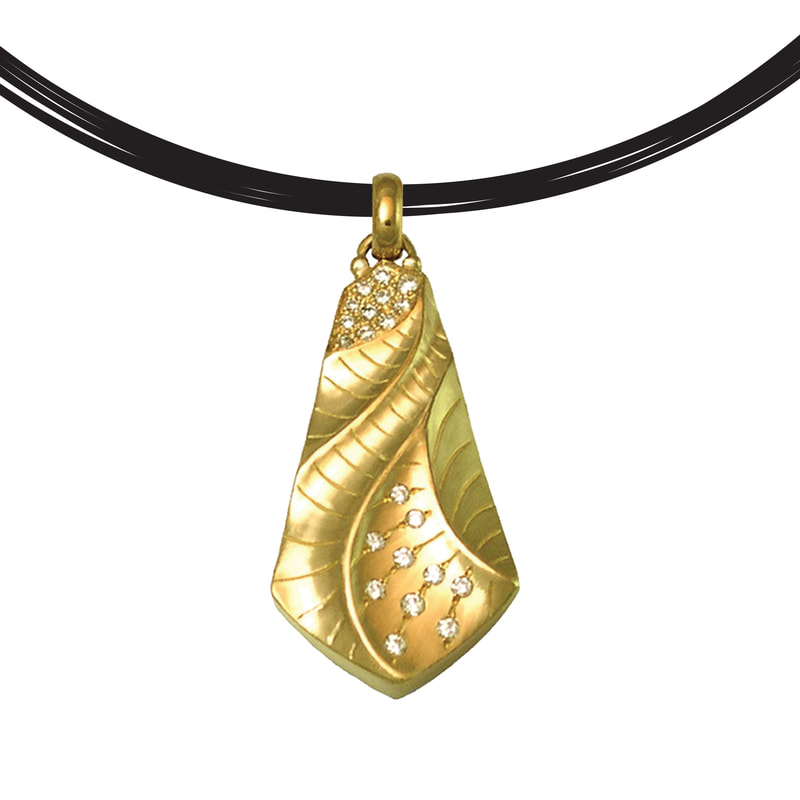 18 Karat Yellow Gold "Kite" Pendant with sculpted gold in a kite shape and scattered with diamonds.