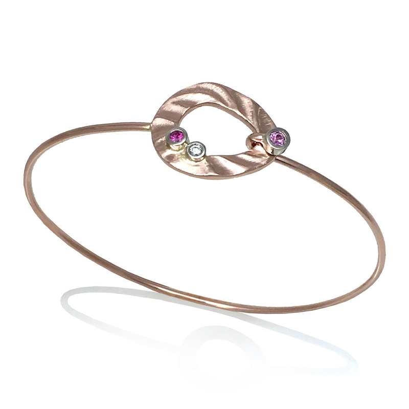 14 Karat Pink Gold Bracelet with an open loop of gold with Pink Sapphire and diamond on the top.