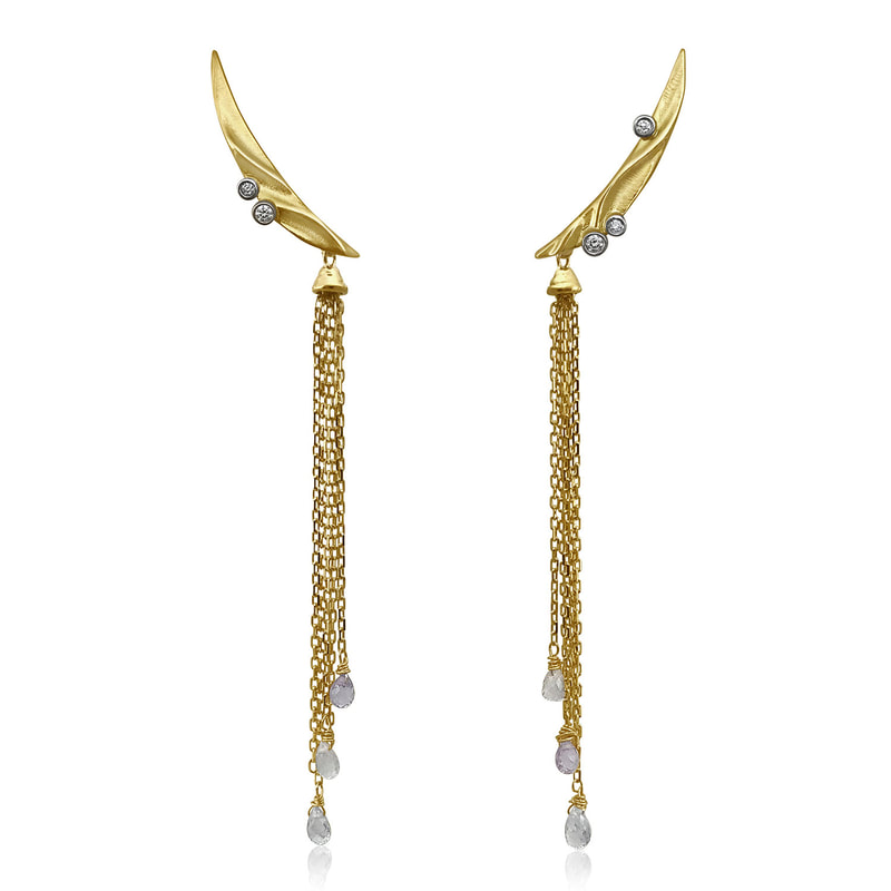 Gold earrings shaped like Crescent Moons with dangling gold chain with briolette Sapphires at the ends.