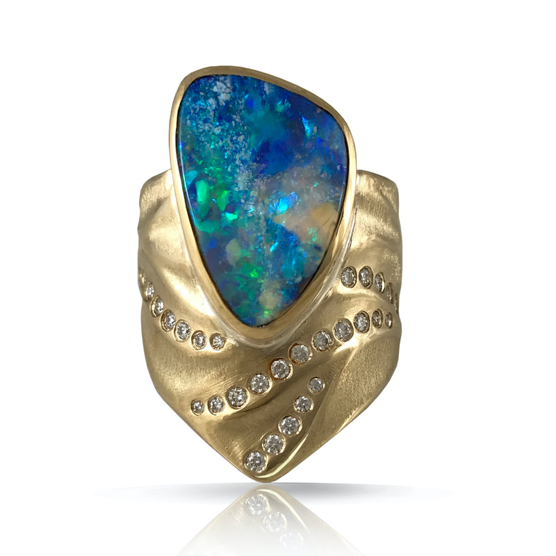 18K Yellow Gold wide ring with Opal and scattered flush set diamonds.
