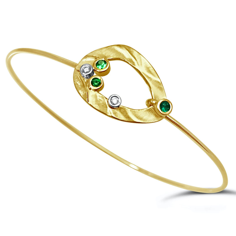14 Karat Yellow Gold bangle bracelet with Green Garnet and diamonds.