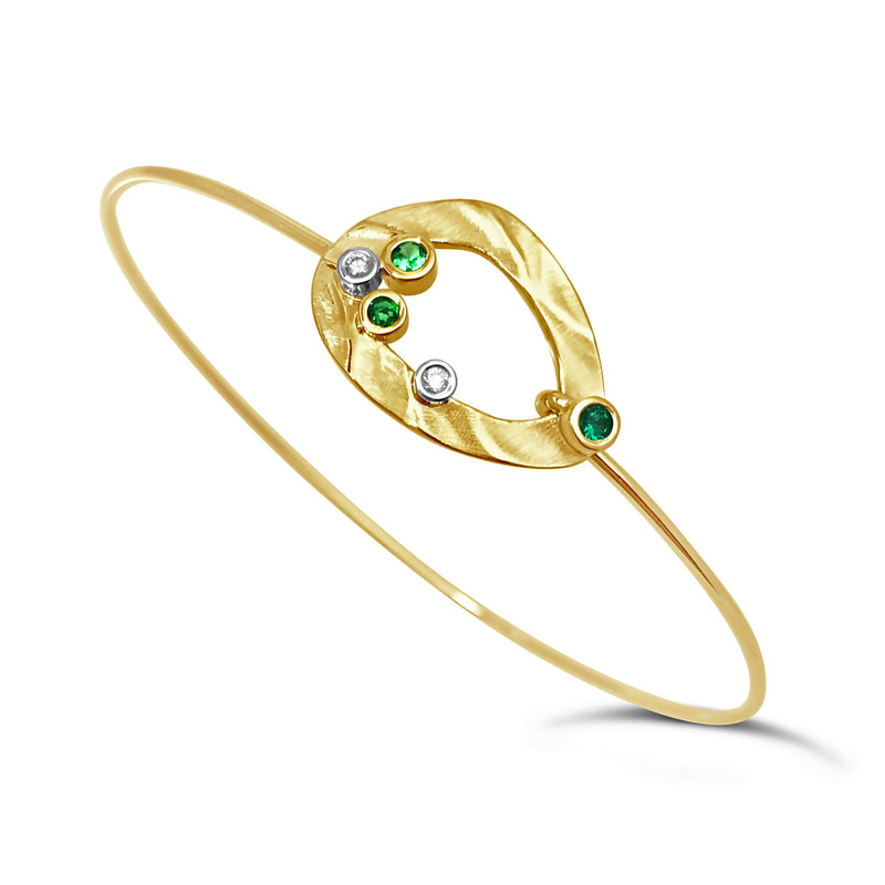 14 Karat Yellow Gold with an open off-round centerpiece with Green Garnet and Diamond.