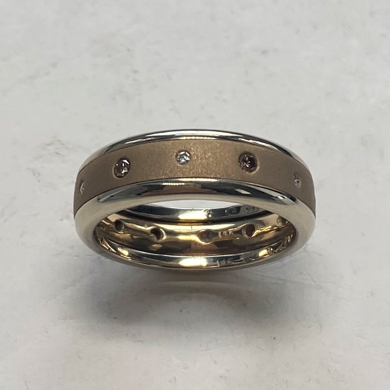 18KY & 18KW ring with two rounded edge bands, Irradiated Cognac diamonds alternating with with diamonds all the way around.