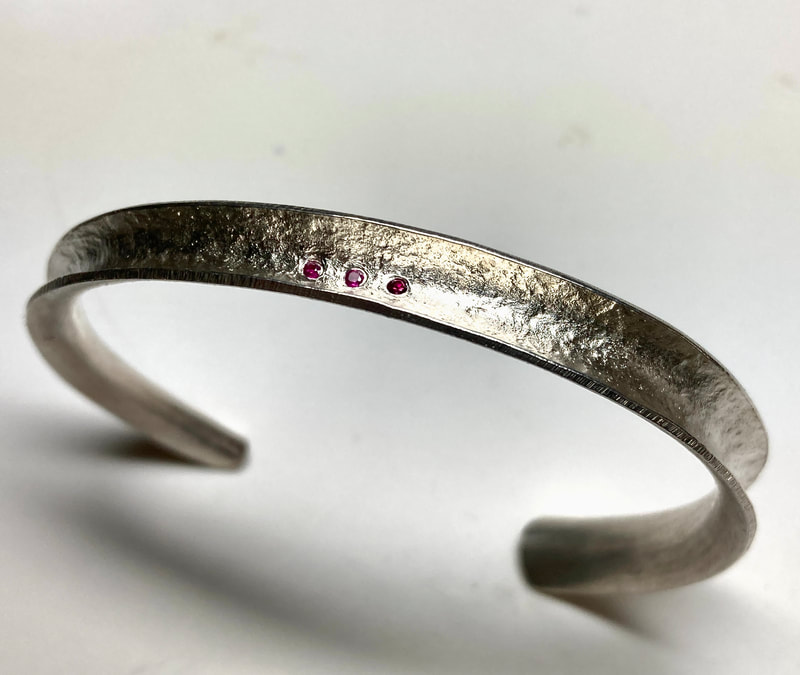 Sterling Silver Cuff Bracelet with three small Rubies