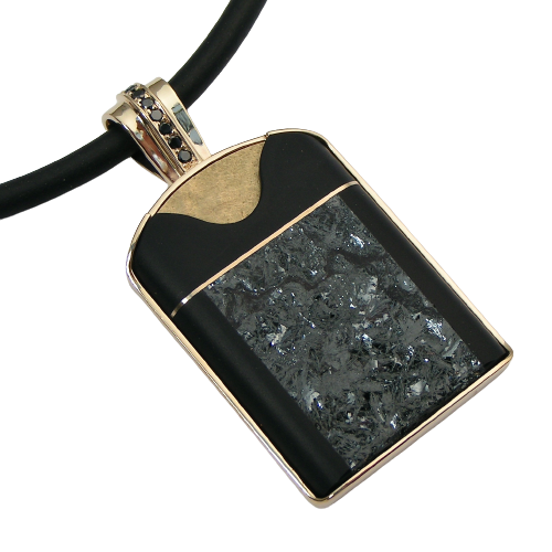 14 Karat Yellow Gold pendant with carved Onyx, Hematite and Black Diamonds on the bail on a black neoprene neck wire.
