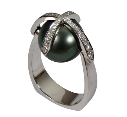 14 Karat White Gold Ring with a Black Tahitian Pearl and diamonds criss crossed over the top.