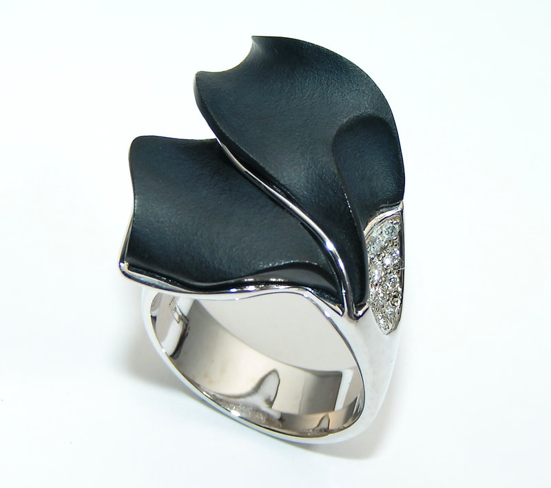 14K White Gold ring with carved Black Onyx and diamonds.