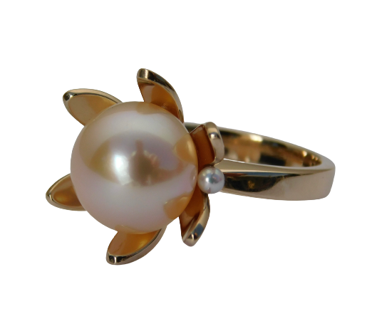 14K Yellow Gold ring with one Pearl in the center of petals of Gold and a small pearl on each side.