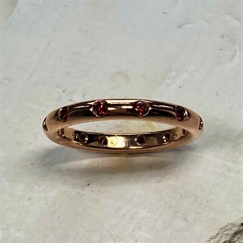 14 Karat Rose Gold High Dome Band with Color Enhanced Red Diamonds.