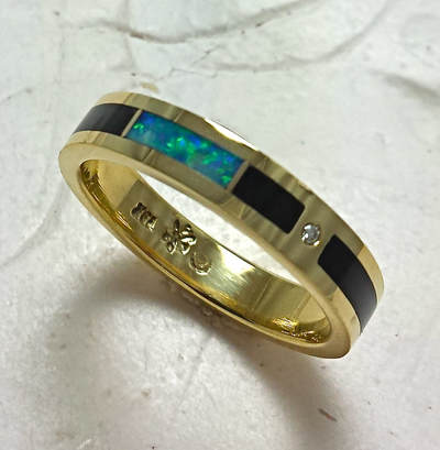 14 Karat Yellow Gold straight band with Opal and Black Jade inlay.