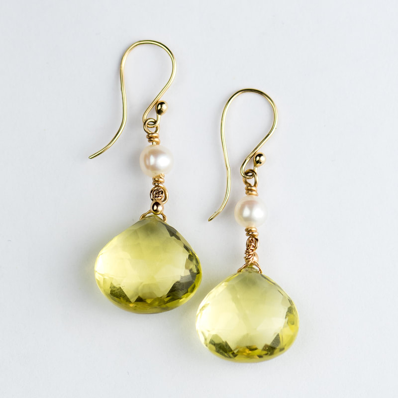 14 Karat Yellow Gold dangle French wire earrings with pear shaped Quartz and round pearls.