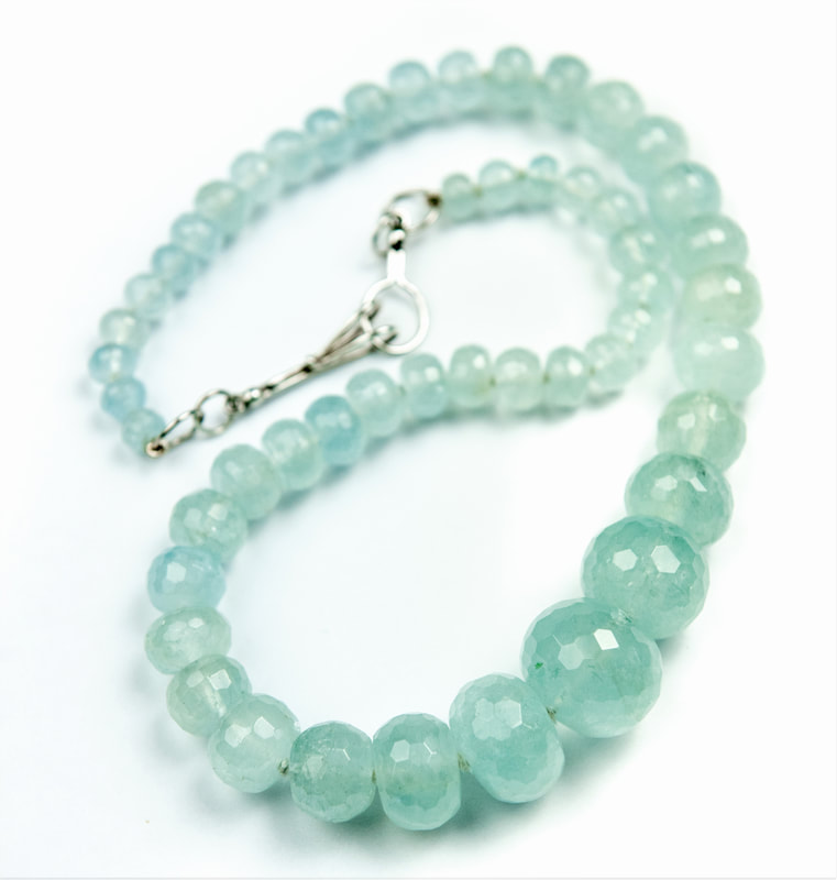 Sterling Silver graduated faceted Aquamarine bead necklace.