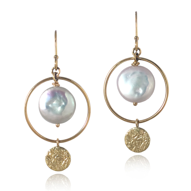14 Karat Yellow Gold circle dangle earrings with coin Pearls in the center and a Gold disc on the bottom.
