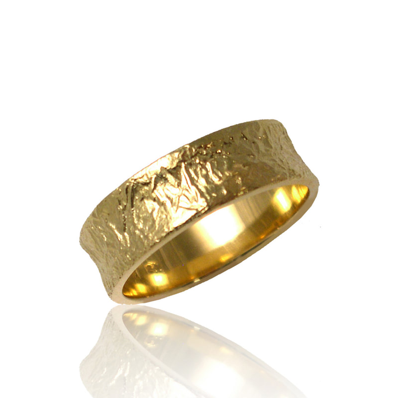 18 Karat Yellow Gold 6mm concaved textured band ring.