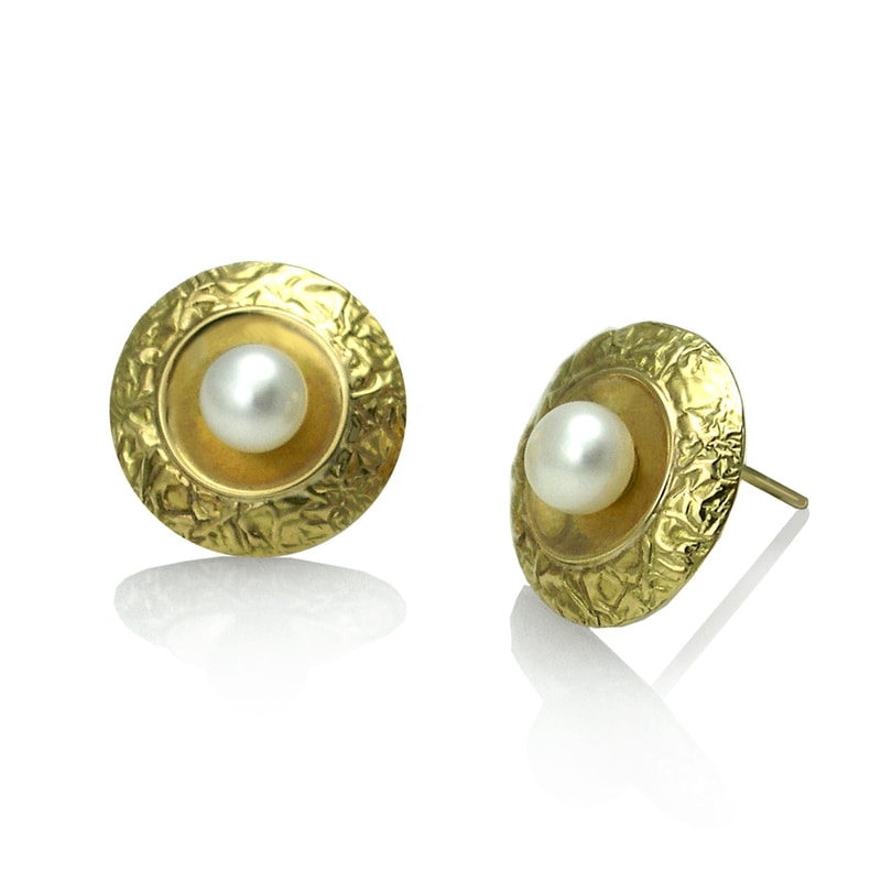 18 Karat Yellow Gold textured gold post earrings with small pearls in the center.